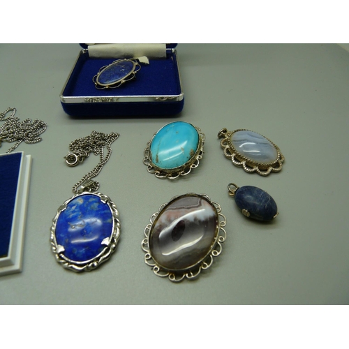 983 - Three hallmarked silver mounted pendants, two other pendants and three brooches