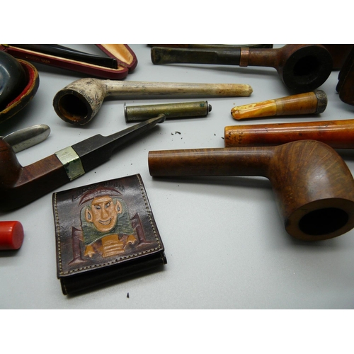 992 - A collection of pipes, a Bakelite cased razor and a Bakelite cased cigarette holder