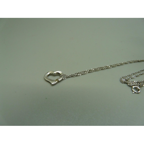 993 - A 9ct white gold pendant with diamond on a silver chain and a pair of 9ct gold and pearl earrings