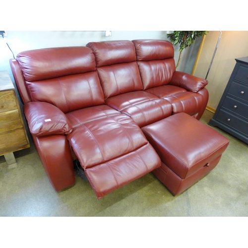 1348 - A red leather electric reclining sofa and footstool