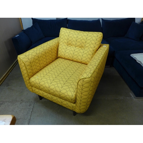 1358 - A turmeric patterned upholstered armchair