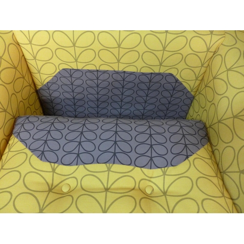 1358 - A turmeric patterned upholstered armchair