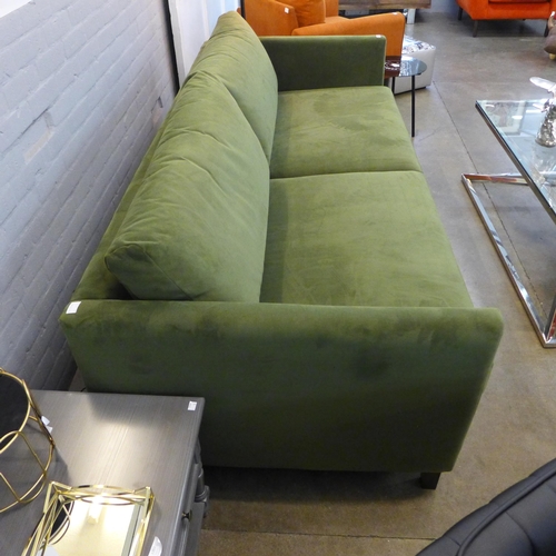 1369 - A forest green velvet upholstered three seater sofa