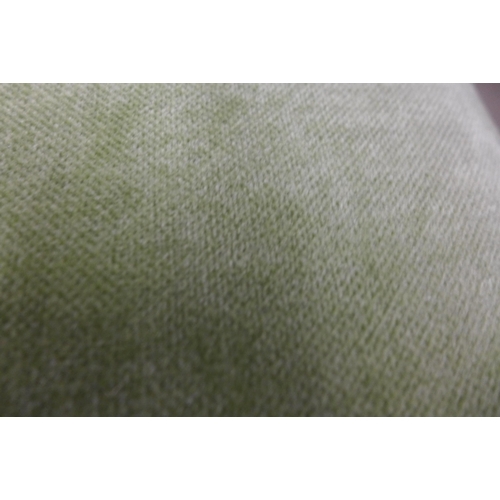 1373 - A lime green velvet two seater sofa