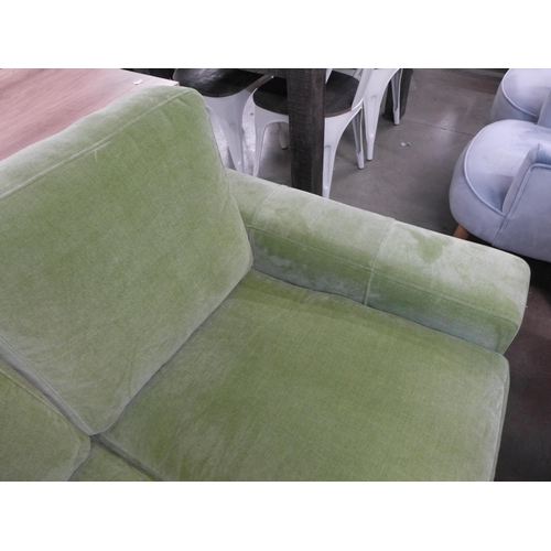 1373 - A lime green velvet two seater sofa