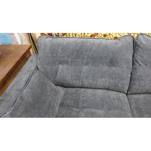 1380 - A Nero blue fabric three seater sofa on semi exposed timber frame