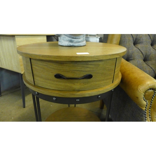 1330 - A circular single drawer wooden and metal side table