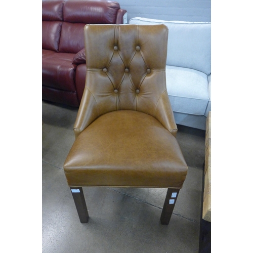 1351 - A Cerato leather and studded chair