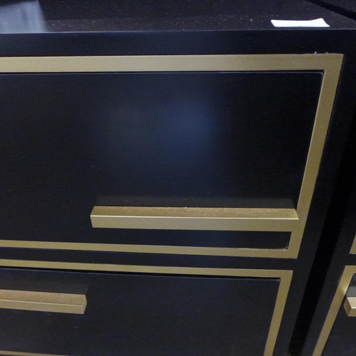 1486 - A black two drawer bedside chest with gold legs