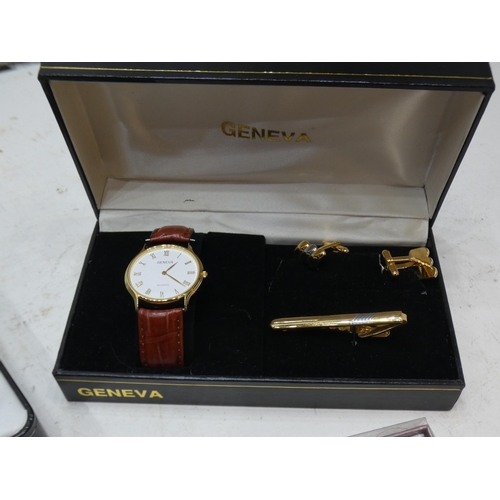 2334 - 4 Boxed wristwatches: 1 Geneva with cufflinks and tie pin; 2 Omaki lady's fashion/occasional watches... 