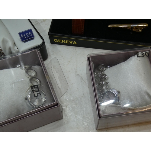 2334 - 4 Boxed wristwatches: 1 Geneva with cufflinks and tie pin; 2 Omaki lady's fashion/occasional watches... 