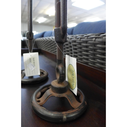 1565 - A pair of industrial style candle holders