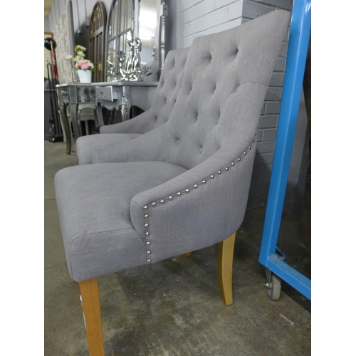 1572 - A pair of grey fabric studded side chairs