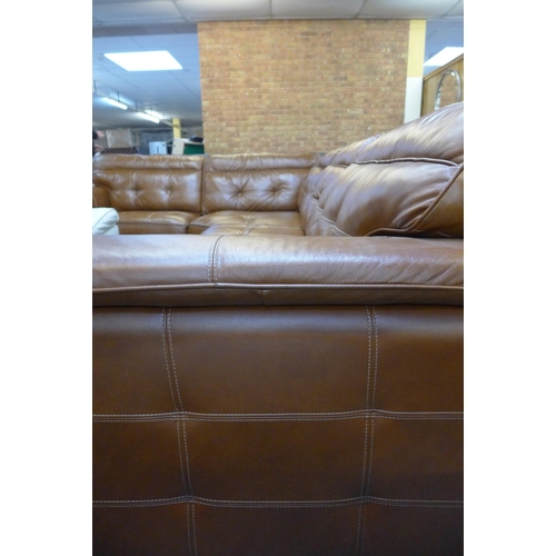 1583 - A tan leather corner sofa