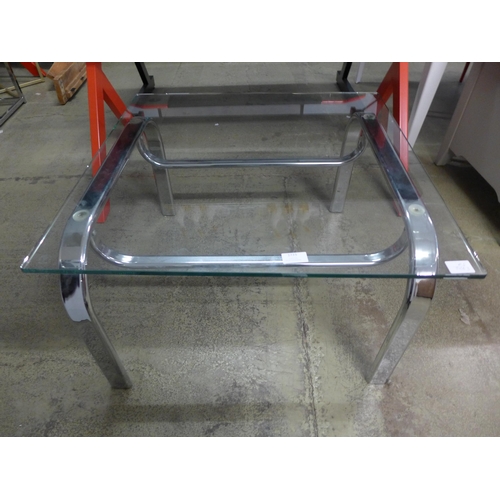 1733 - A square glass top coffee table with chrome legs