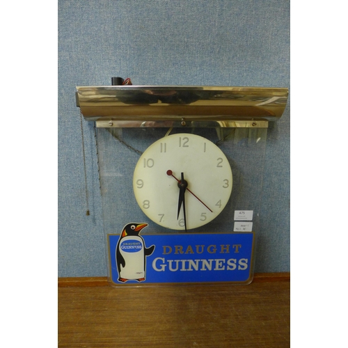 596 - A Perspex Draught Guinness advertising clock