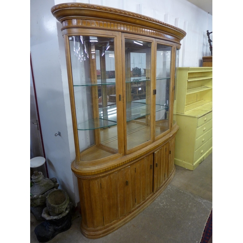 597 - A large oak and beech shop cabinet, 228cms h, 202cms w, 45cms d