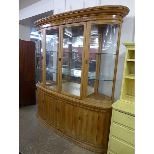 597 - A large oak and beech shop cabinet, 228cms h, 202cms w, 45cms d