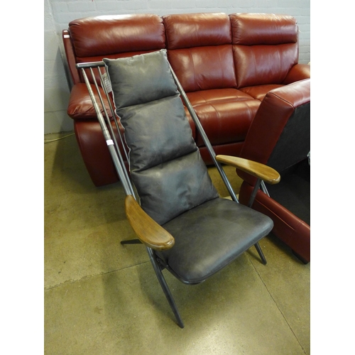 1997 - An Ely studio chair with gun metal frame and grey leather cushions