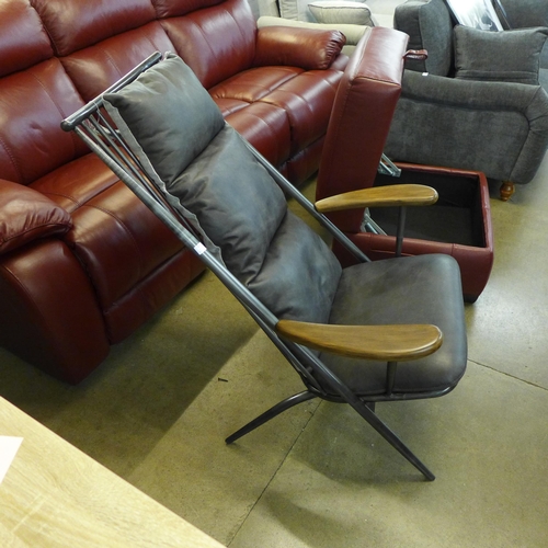 1997 - An Ely studio chair with gun metal frame and grey leather cushions