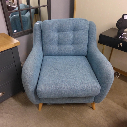 1999 - An Aegean blue textured weave armchair with electric footrest