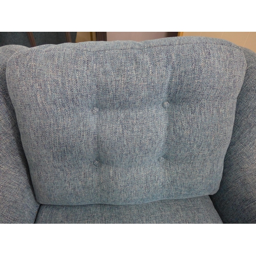 1999 - An Aegean blue textured weave armchair with electric footrest