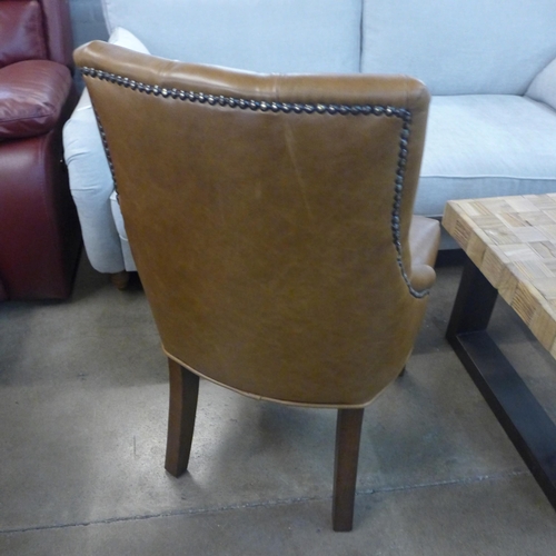 1357 - A Cerato leather and studded side chair