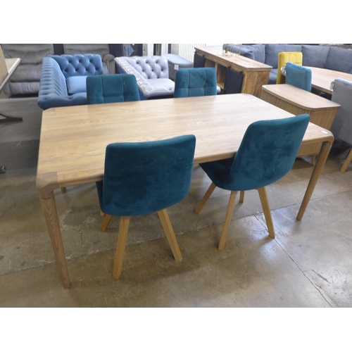 1399 - A Halcot oak mid century style dining table and four teal velvet chairs