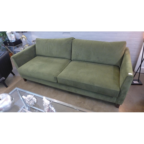 1424 - A forest green velvet upholstered three seater sofa