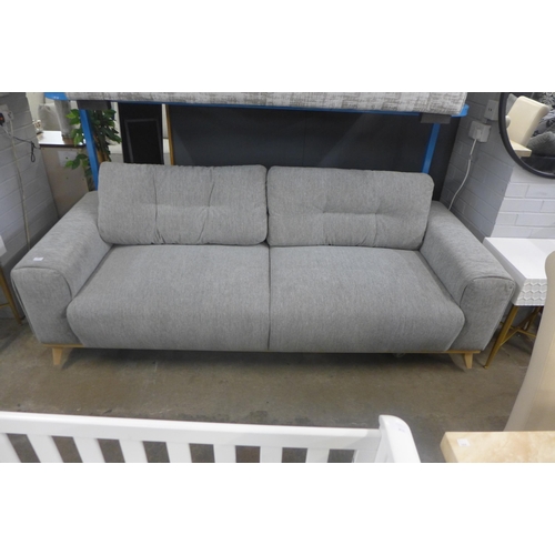 1437 - A Modestro light grey fabric three seater sofa