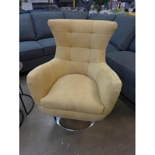 1301 - A mustard suede upholstered swivel armchair with a chrome base  *This lot is subject to VAT