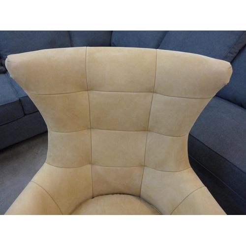 1301 - A mustard suede upholstered swivel armchair with a chrome base  *This lot is subject to VAT