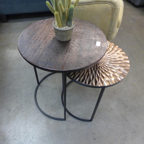 1302 - A copper effect circular nest of two tables with industrial style metal bases  *This lot is subject ... 