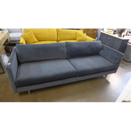 1312 - An ash grey velvet upholstered four seater sofa