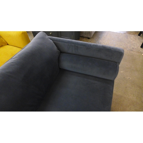 1312 - An ash grey velvet upholstered four seater sofa