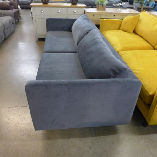 1312 - An ash grey velvet upholstered four seater sofa