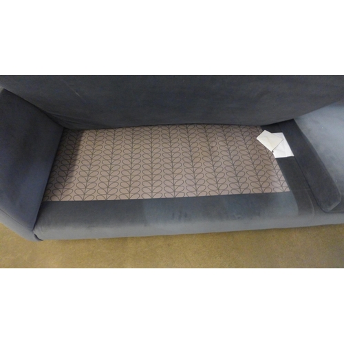 1312 - An ash grey velvet upholstered four seater sofa