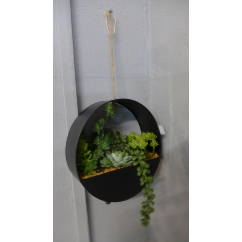 1331 - A display of artificial succulents in a round metal hanging pot, H 20cms (67444212)   #