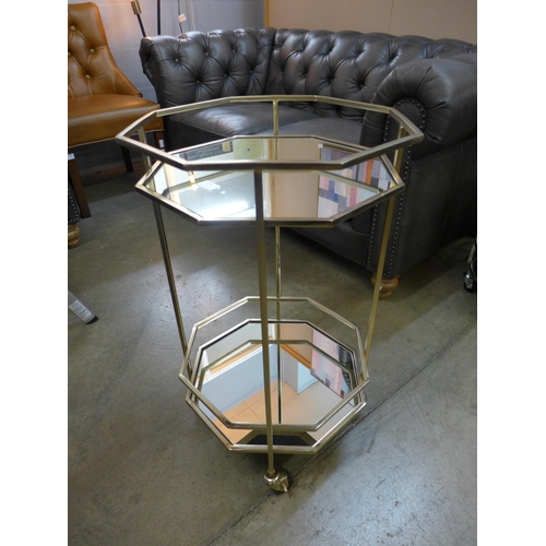 1354 - An octagonal metal and mirrored drinks trolley  *This lot is subject to VAT