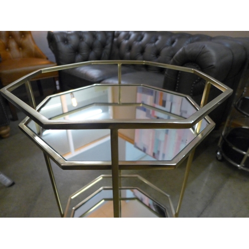 1354 - An octagonal metal and mirrored drinks trolley  *This lot is subject to VAT