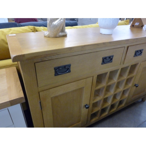 1463 - A Rutland oak large sideboard with wine rack *This Lot is Subject to VAT*