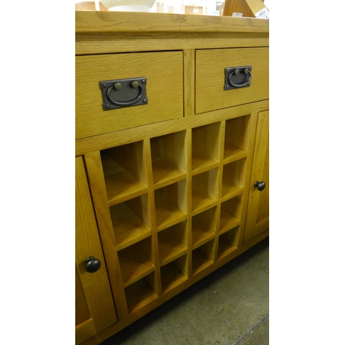 1463 - A Rutland oak large sideboard with wine rack *This Lot is Subject to VAT*