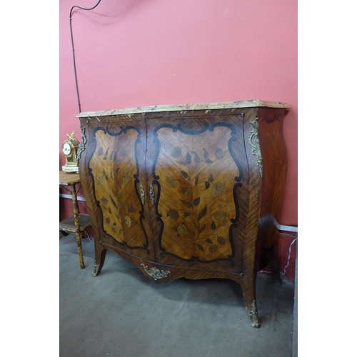 24 - A 19th Century French marquetry inlaid, rosewood, mahogany and marble topped bombe shaped side cabin... 