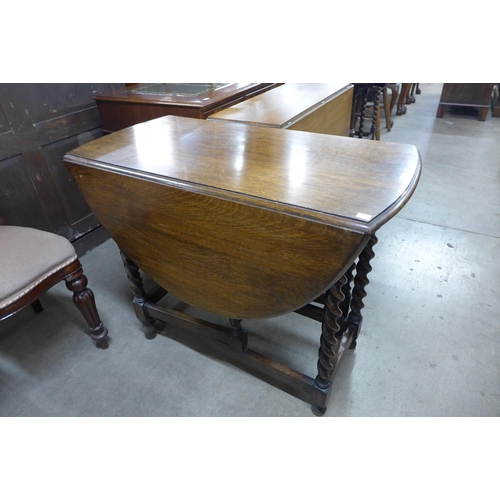 155 - An oak barleytwist gateleg table