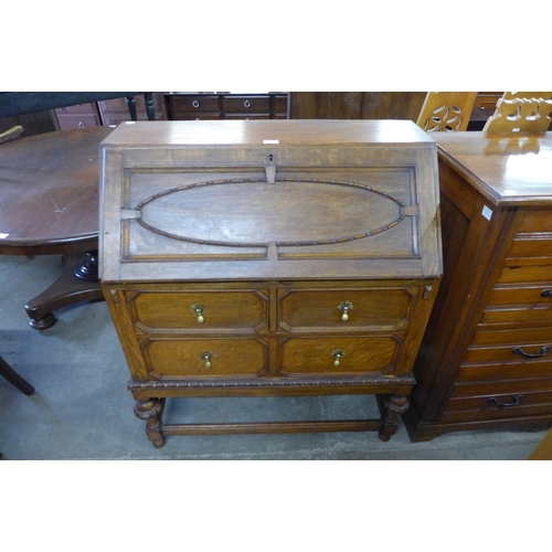 107 - A carved oak bureau