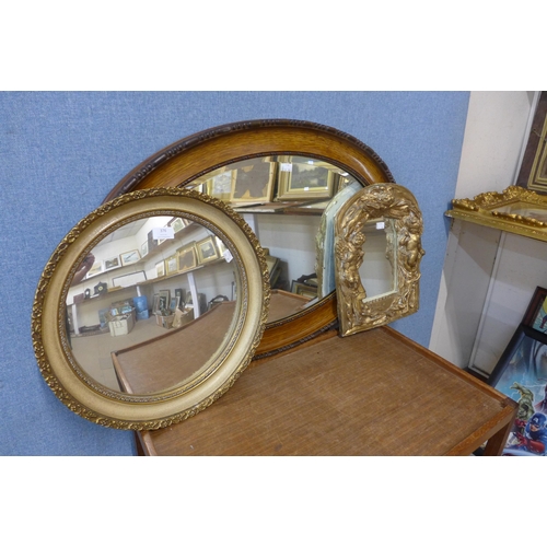 446 - A simulated oak framed oval mirror and two gilt framed mirror's