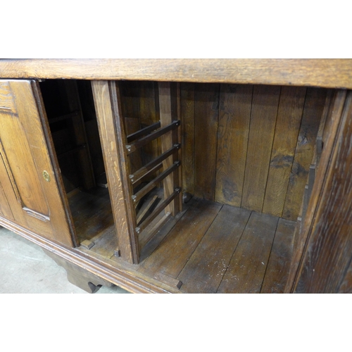 1 - A George III style oak housekeeper's cupboard, 220cms h, 172cms w, 56cms d