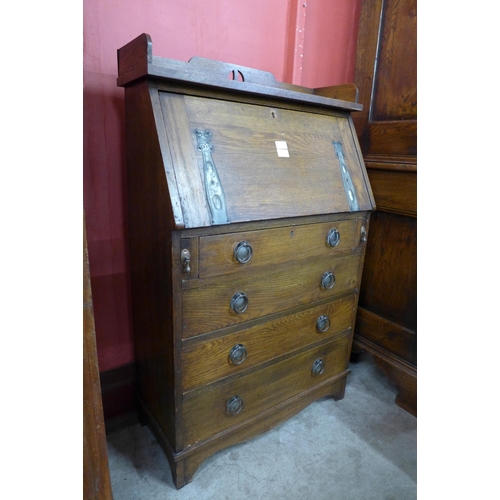 10 - An Arts and Crafts oak bureau