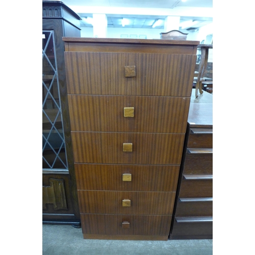 100 - A tola wood chest of drawers