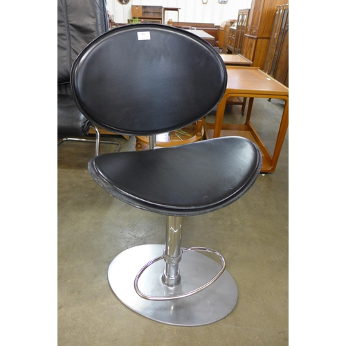 102 - An ArrMet Tamago chrome and black leather bar stool, designed by Robert Cantarotti